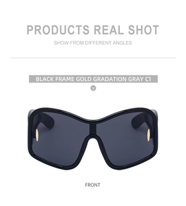 Front view of black oversized sunglasses with gradient grey lenses and gold rivets