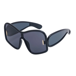 Modern oversized wrap-around black sunglasses with dark gray lenses and gold accents