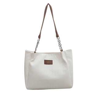 Grand sac cabas blanc avec texture matelassée et lanières en cuir marron et chaîne