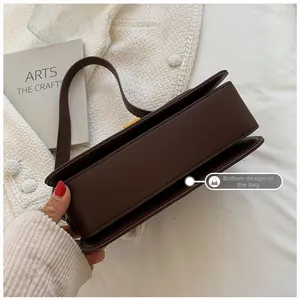 Detail showing high-quality leather bag base design with precise stitching and texture