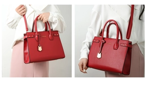 Dettaglio della borsa rossa in ecopelle con forma a trapezio e logo dorato lucido