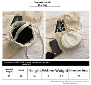 Detailed size chart and internal capacity view for cream pleated drawstring bucket bag