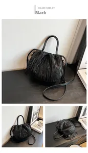 Detailed views of black pleated drawstring bucket bag with shiny PU leather texture
