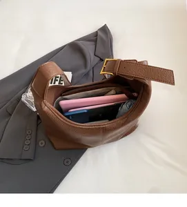 Detailed internal view of large brown leather bucket bag showing spacious storage capacity