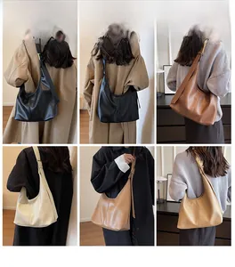 Chic hobo shoulder bag styled on model in multiple colors with pebbled leather texture