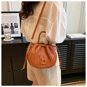 Brown pleated drawstring bucket bag with textured synthetic leather for casual daily wear