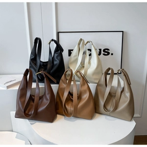 Close-up of five leather hobo bags in assorted colors with litchi grain texture