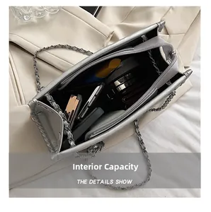 Silver-grey quilted chain bag showing spacious internal capacity and layered compartments