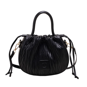 Fashionable black pleated bucket bag with dual handles and adjustable drawstring closure