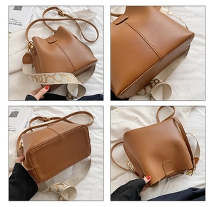 Détails du sac seau marron en similicuir avec ses deux bandoulières et ses coutures