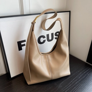 Chic camel hobo shoulder bag with litchi grain texture and gold hardware accessories