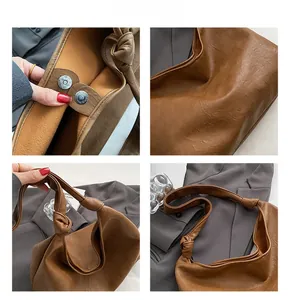 Detail view of brown vintage leather bucket bag showing magnetic closure and soft texture