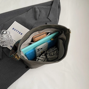 Minimalist grey leather tote bag with ethnic wide strap and spacious inner compartments