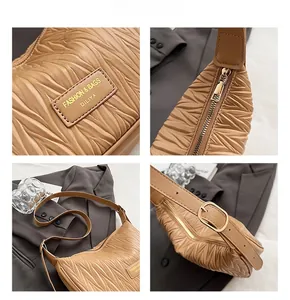 Detailed views of khaki pleated dumpling bag showing leather texture and gold hardware