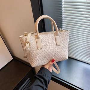 Cream white woven leather tote bag with gold hardware and adjustable strap for women