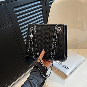 Chic black matelassé chain shoulder bag for women with elegant silver hardware details