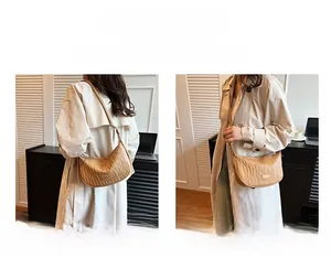 Detail of beige pleated dumpling bag showing single shoulder and crossbody styling options