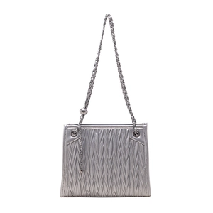 Silver metallic pleated crossbody bag with chunky chain strap and ball charm