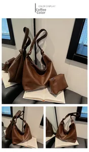 Detail of coffee brown leather tote bag set with knot shoulder strap and inner pouch