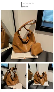 Detail view of brown soft leather hobo bag and small pouch set with knotted shoulder strap