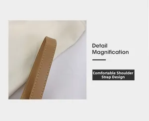 Dettaglio della comoda tracolla in pelle marrone con cuciture precise sulla borsa