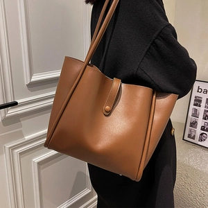 Brown large-capacity leather tote bag for women with stylish strap and matte finish