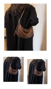 Close-up of brown leather hobo bag showing retro pleated texture and adjustable strap