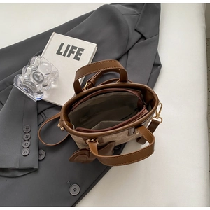 Top view of mini tote bag showing dark gray fabric lining and internal zipper pocket