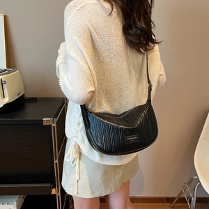 Chic black pleated hobo bag for women featuring premium wavy texture and crossbody strap