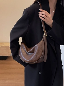 Vintage brown crescent shoulder bag in oily faux leather with adjustable strap for women