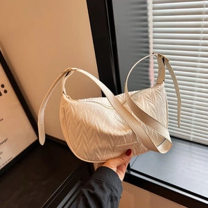 White pleated croissant shoulder bag with adjustable strap and metal logo plate