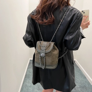 Retro olive green mini backpack with metal chain straps and drawstring flap closure