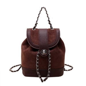 Minimalist coffee brown backpack with matte finish and elegant chain strap detail