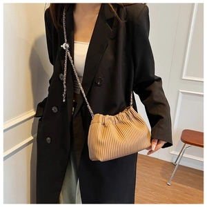 Fashionable pleated bucket bag in khaki with a chic silver chain and leather strap