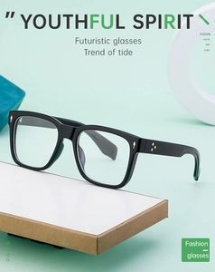 Close-up of black square frames with silver arrow rivets and metallic side dots