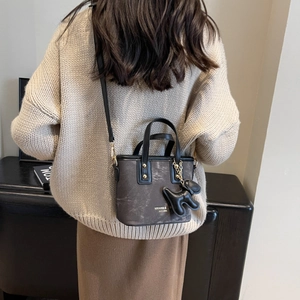 Retro brown mini tote bag with puppy pendant and gold lettering for women