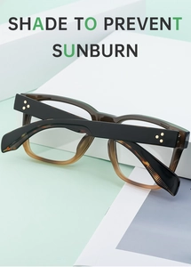 Detail of square black and tea brown gradient frame with three gold star rivets