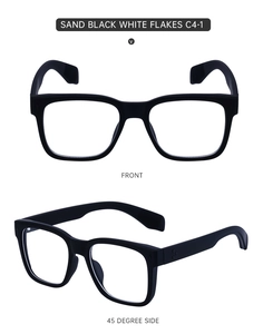 Macro view of sand black square glasses frame with decorative silver dots on the temple