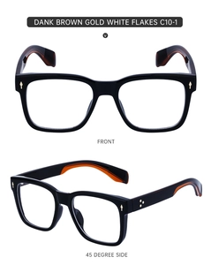 Detail view of square black frame glasses with gold diamond rivets and metal accents