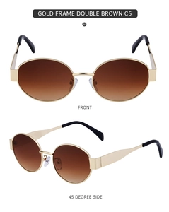 Detail view of oval sunglasses featuring a gold metal frame and double brown gradient lenses