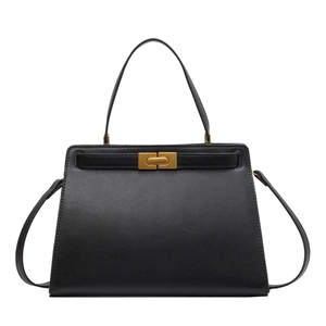 Elegant black leather trapezoid handbag with gold metal clasp for office commute