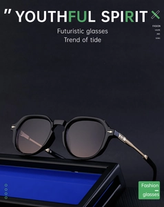 Detailed close-up of retro square sunglasses with golden metal temples and dark lenses