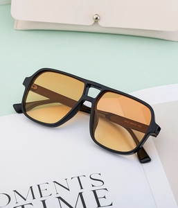 Detail of retro double-bridge sunglasses with orange gradient lenses and model 3452 code