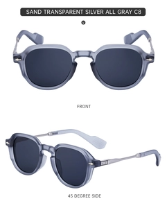 Detailed front and side view of sand transparent silver sunglasses with dark gray lenses