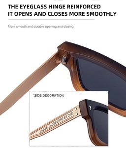 Detail der verstärkten Metallscharniere und gravierten Verzierung der bernsteinfarbenen Brille