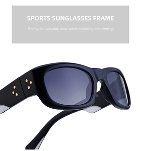 Detail of polarized sports sunglasses showing gold star rivets on glossy black frame temples