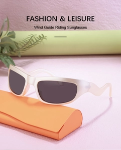 Detail of Y2K sporty windproof sunglasses with wavy frame and orange eyewear case