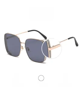 Detail view of square rose gold frame sunglasses with glitter hinges and grey lenses