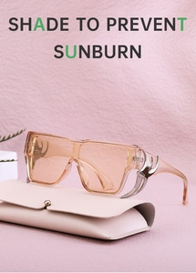 Detail of pink square sunglasses featuring stylish silver eagle claw metal temples
