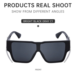 Front view of bright black square frame sunglasses with silver metal claw temple details